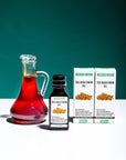 Sea Buckthorn Oil bottle with two boxes and glass jug