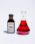 Sea Buckthorn Oil bottle and glass jug