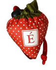 Red strawberry-shaped reusable bag with polka dots and drawstring closure, featuring a white E logo, perfect for eco-conscious shopping