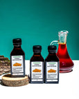 Three Sea Buckthorn Oil bottles with glass jug