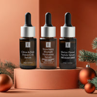 Eminence Organic serums trio with festive pine branches