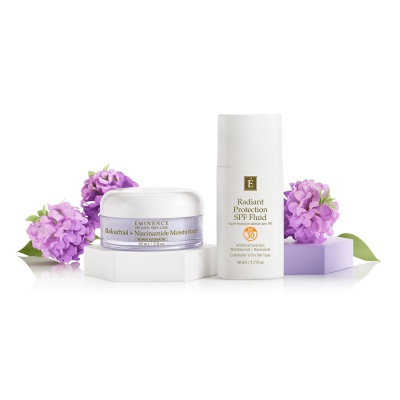 Eminence Bakuchiol Moisturizer and SPF Fluid with flowers