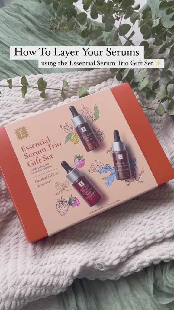 Box of Eminence Organic Essential Serum Trio Gift Set on cozy blanket