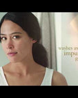 Woman using Eminence Coconut Milk Cleanser